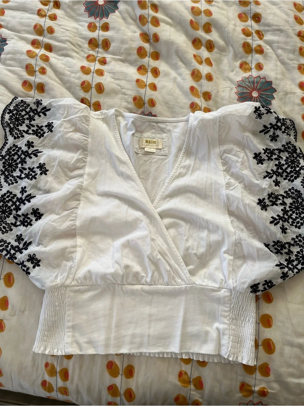 Anthropologie White Puff-Sleeve Wrap Top with Navy Floral Embroidery